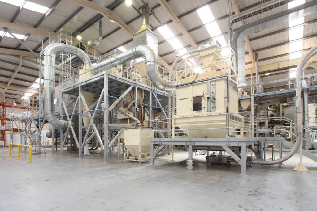 Tubular conveyor system in a production facility