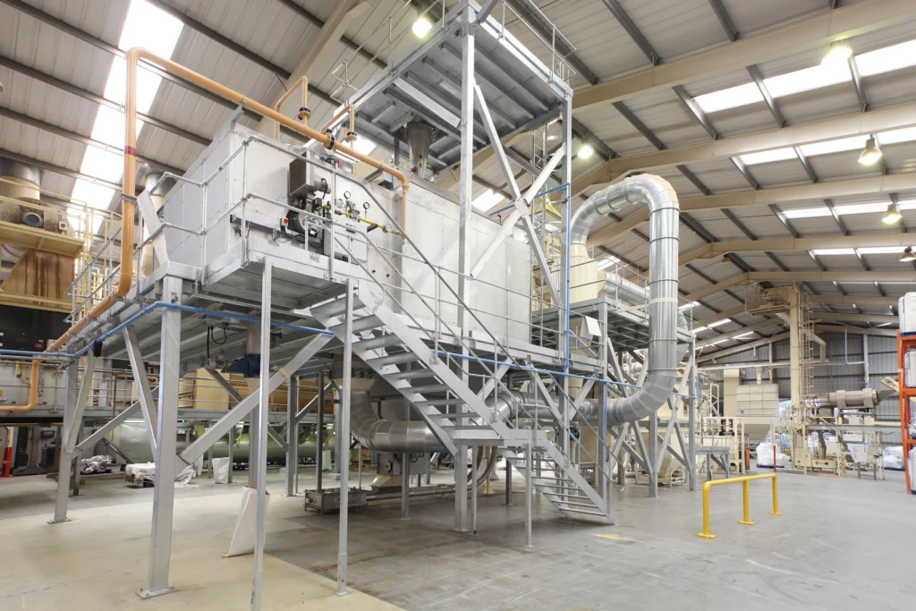 Large tubular conveyor system in a production facility