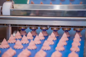 Cakes on an automatic conveyor belt system 